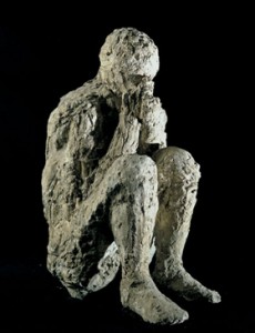 cast of a crouching man pompeii victim