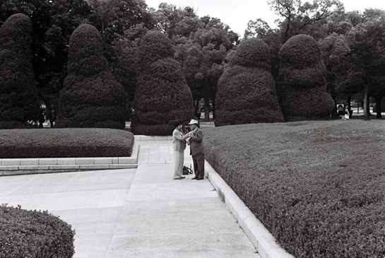 Josiane Keller - husband and wife at the Hiroshima Peace Memorial, adjusting the tie