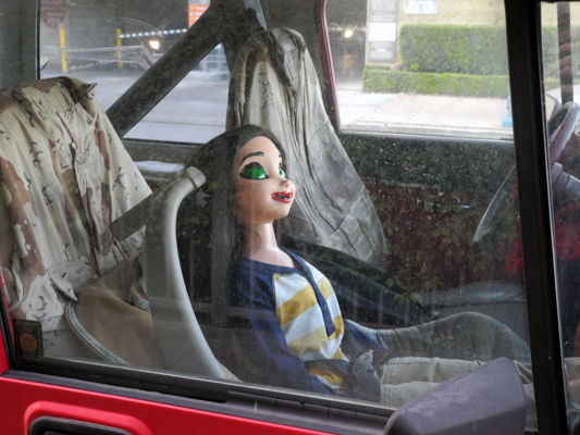 Josiane Keller - puppet riding in passenger seat