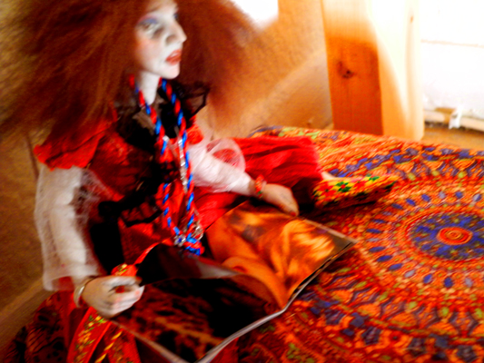 Josiane Keller - Laila reading a magazine on the bed 2